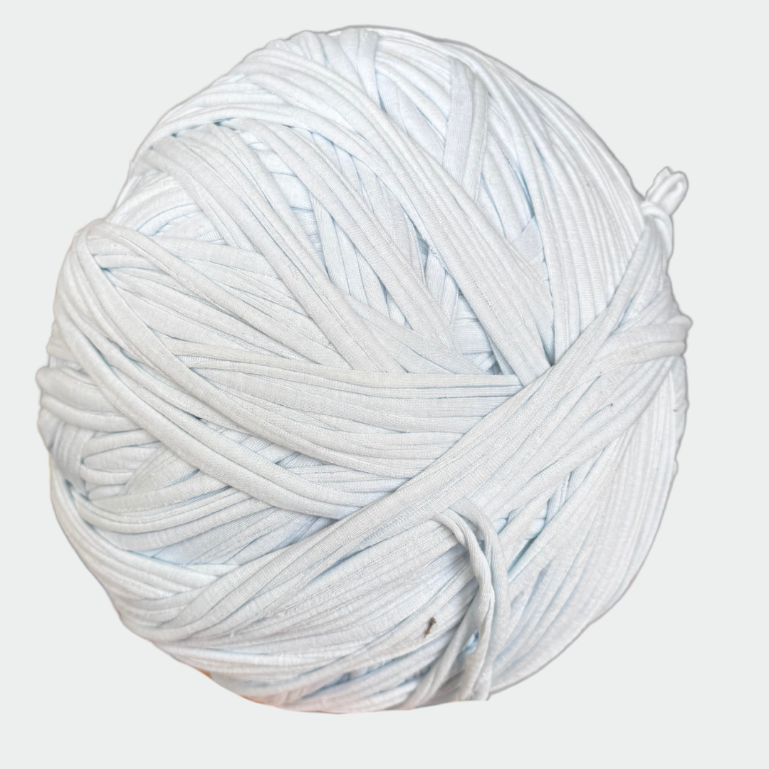 a ball of white yarn on a white background
