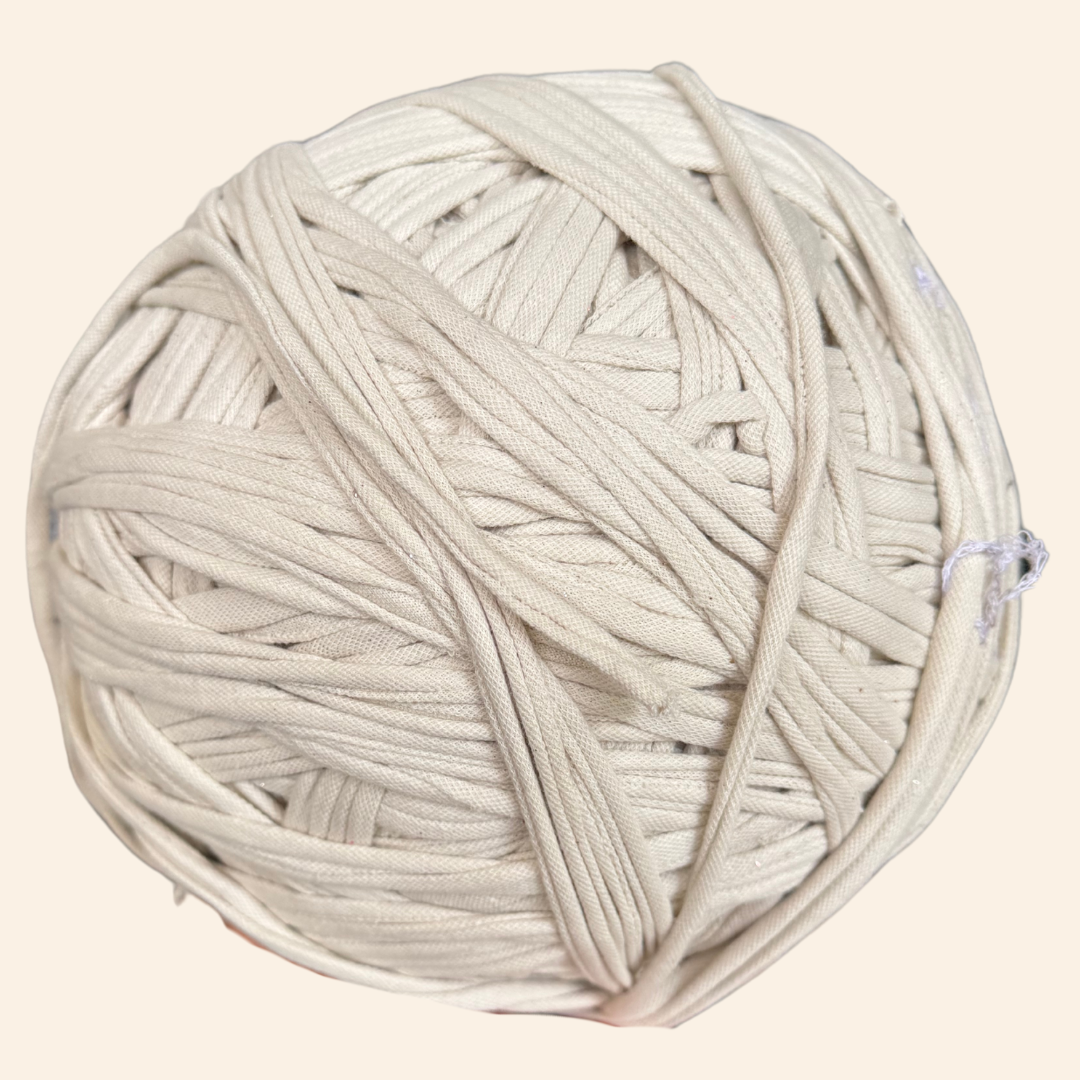 a ball of white yarn on a white background