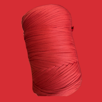a red ball of yarn on a red background