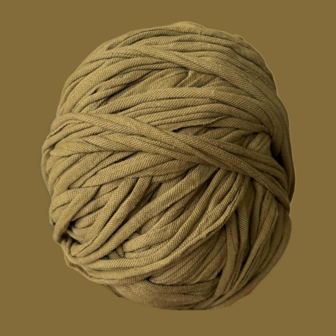 a ball of yarn on a brown background