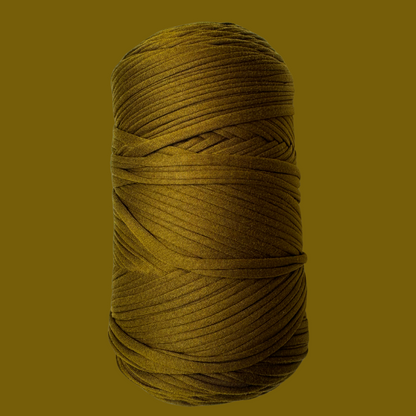 a spool of yellow thread on a brown background
