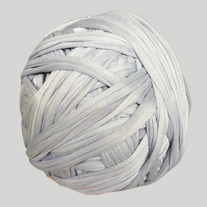 a ball of white yarn on a gray background