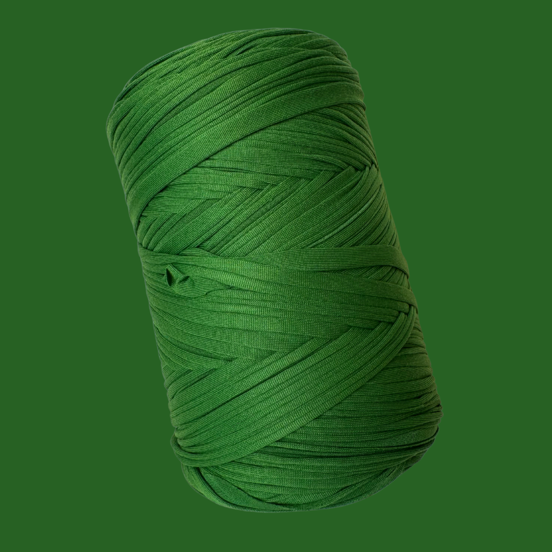 a green ball of yarn on a green background